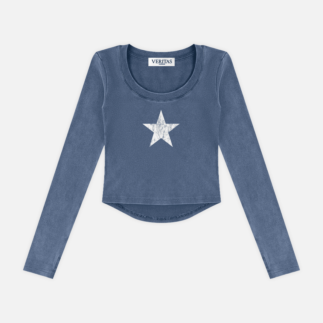 A long-sleeve cropped top in a washed slate blue color, featuring a white distressed star graphic on the center chest. The brand name 'VERIJAS' is visible on the inner neck label.