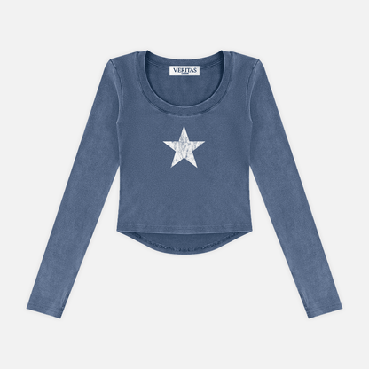 A long-sleeve cropped top in a washed slate blue color, featuring a white distressed star graphic on the center chest. The brand name 'VERIJAS' is visible on the inner neck label.