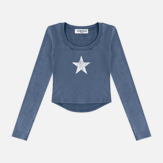 A long-sleeve cropped top in a washed slate blue color, featuring a white distressed star graphic on the center chest. The brand name 'VERIJAS' is visible on the inner neck label.