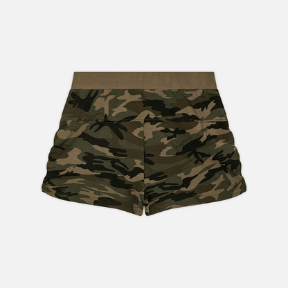 A pair of camouflage shorts in shades of green, brown, and black, featuring a solid olive green waistband, shown flat against a light gray background.